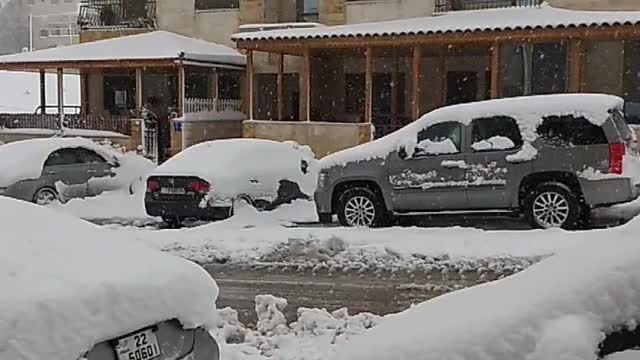 Early morning snow falling in Amman Jordan