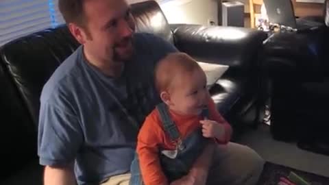 Little baby laughing at the Wii