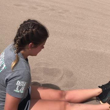 Sand dune sledding. Jose ping gets a mouthful of sand.