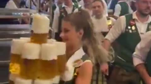 The strength of Oktoberfest waitresses is truly remarkable!