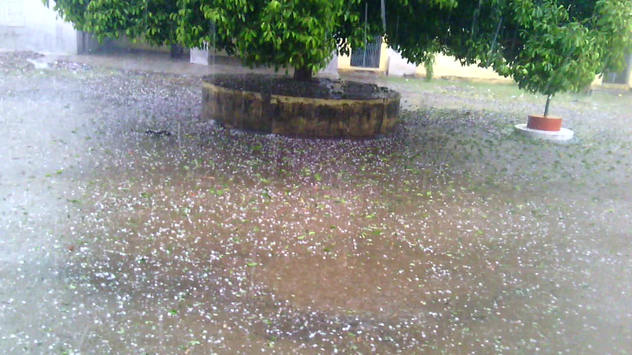 Heavy rain fall with ice cubes falling from the sky.