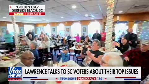 Lawrence Jones III conducts a poll at the Golden Egg Pancake House in Surfside Beach, South Carolina