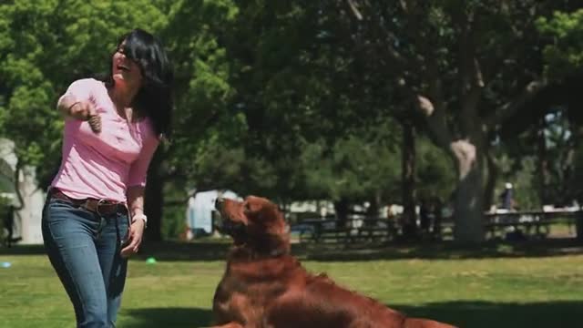 Woman playing with a 🐕