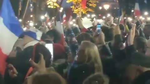 French protestors stand in front of the Austrian Embassy condemning Austria's government