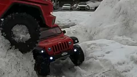 Two SUVs in the snow