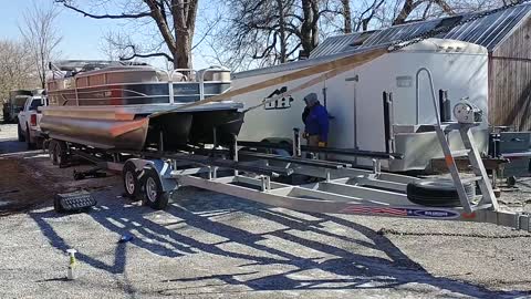 Transferring a Tritoon on land when lakes are frozen