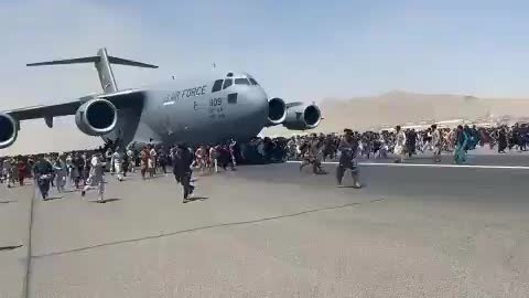 Civilians Try to Hold on to Plane Departing from Kabul