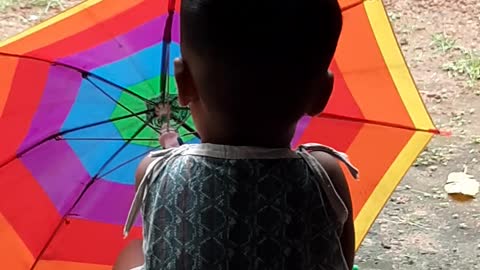 Umbrella repairing boy