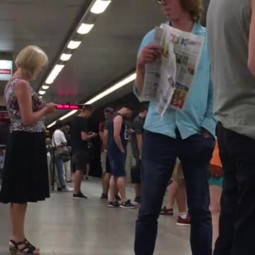 Man in blue shirt stares at two girls