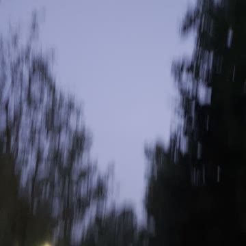 Helicopter flies in at night Edmonton sky