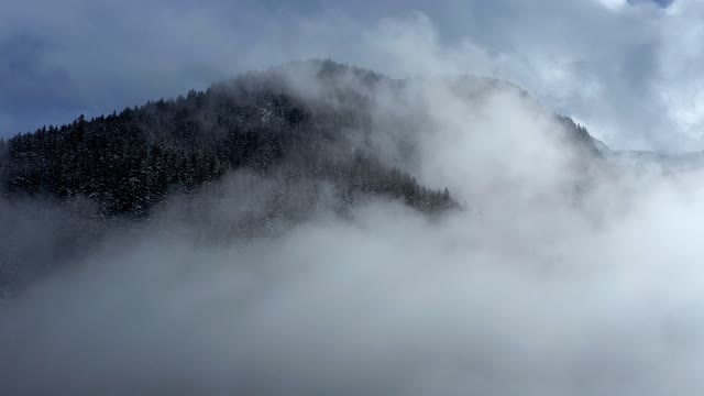 Drone Footage Of A Mountain Valley Covered In Fog