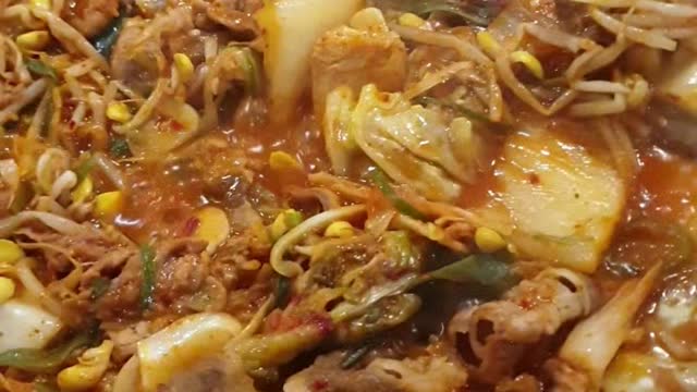 Korean beef yukhoe, yukhoe bibimbap, and miso stew at a Korean restaurant