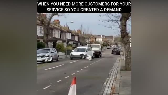 Tow truck smashes car as he drives through London street.