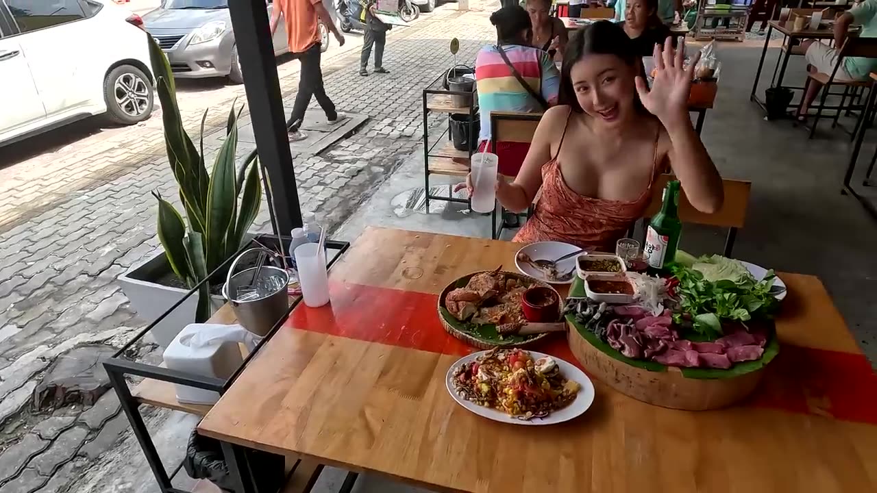 Fresh raw meat salad and Som Tam cooked by beautiful Pattaya Lady