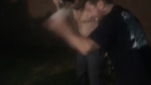 Guys hitting beer cans on head multiple times