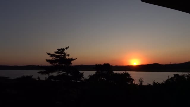 Red sunset, mountains and river trees. 3