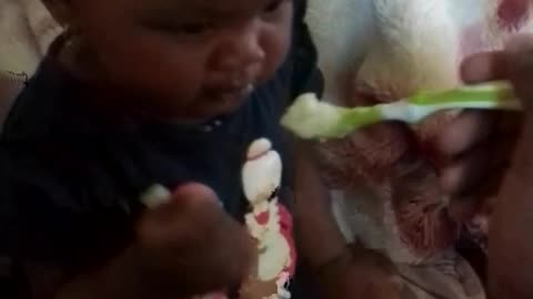 giving baby food my niece