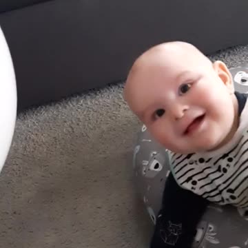 Bouncing A Balloon On This Baby's Head Results In Extremely Contagious Laughter