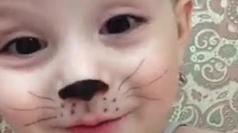 cute baby acting as cat