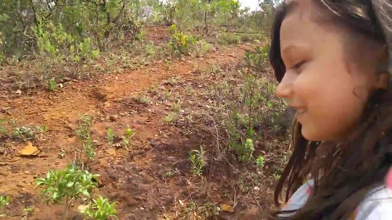 funny child climbing a mountain