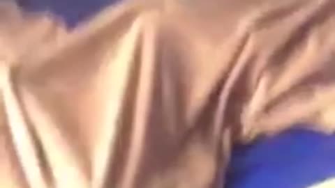 Kid in rainbow hammock falls down