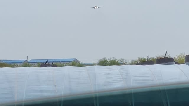 Airplane landing on a rainy day