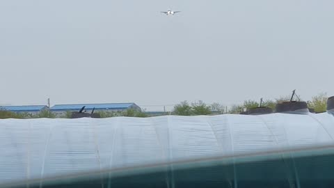 Airplane landing on a rainy day