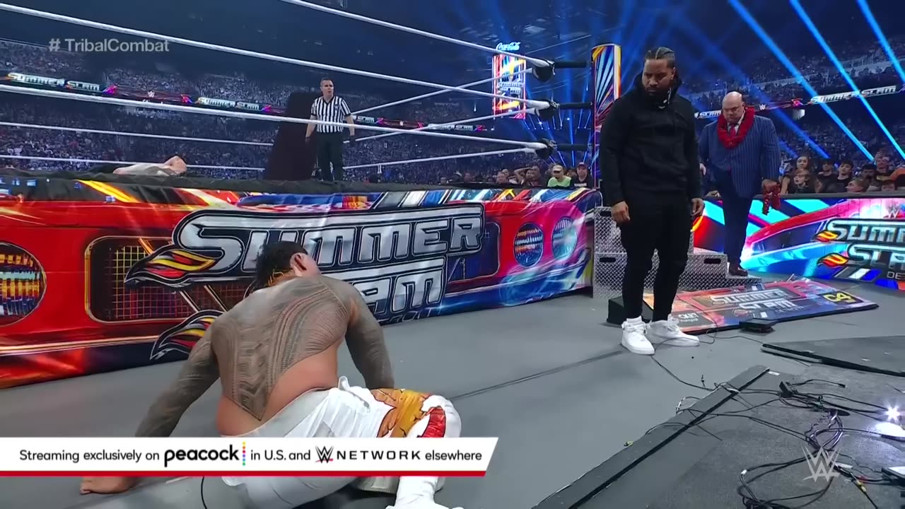 "Chaos in the Ring: Roman Reigns Takes on The Usos"