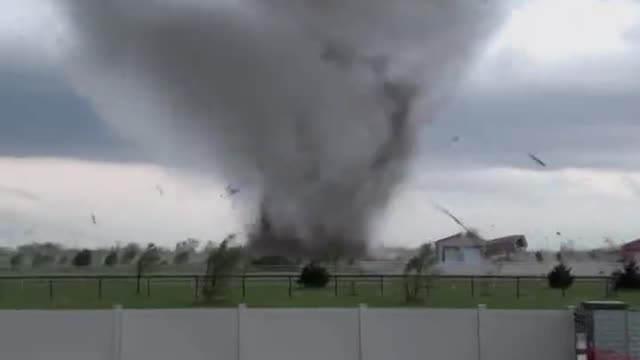 Man continues to film Andover Tornado right up until it swallows his yard