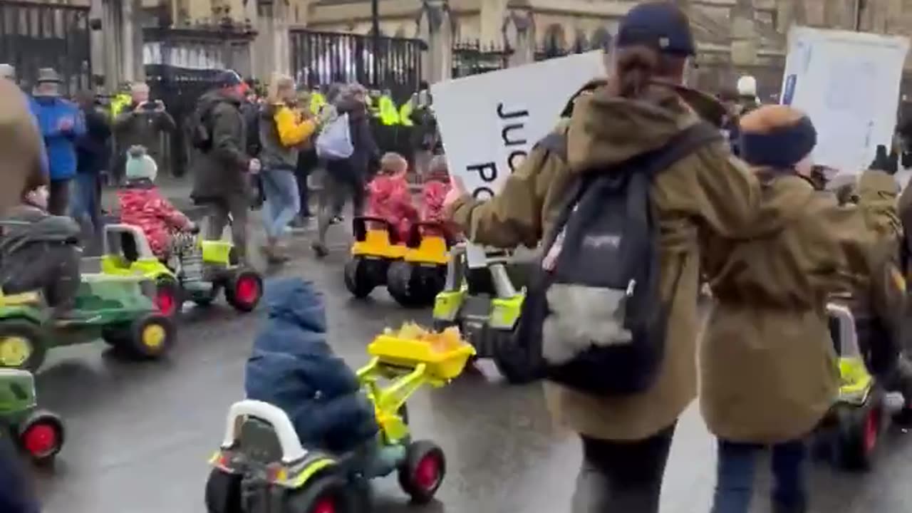 Farmers of the future” cycling their way around Parliament Square in toy tractors