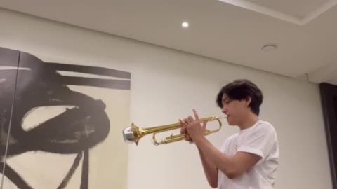 BTS member V has playing the trumpet