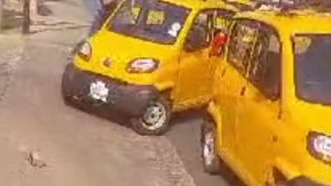 Taxi drivers smash a Bajaj Qute Bolt Lite vehicle