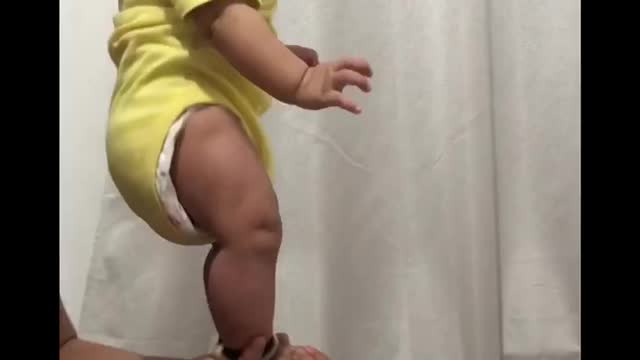 5 months old baby is doing stunt with his dad.