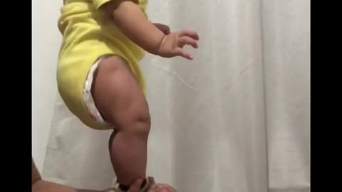 5 months old baby is doing stunt with his dad.