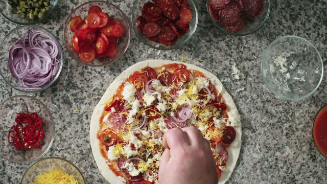 Preparing A Pepperoni Pizza