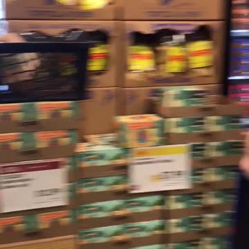 Guys walking with wet suits on halfway