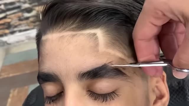 Boy with long lashes gets a little trim!