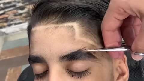 Boy with long lashes gets a little trim!