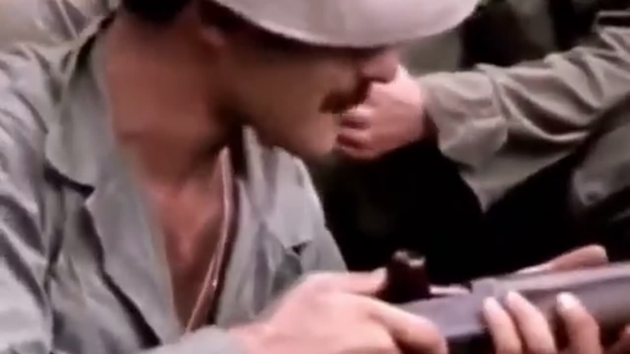 American soldiers in Vietnam smoking Marijuana from the barrel of a shotgun, 1970