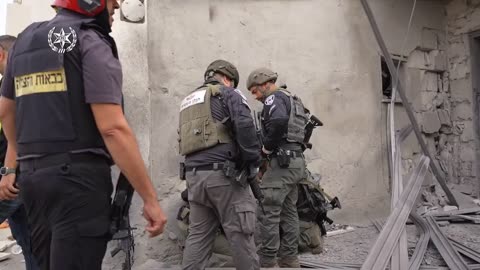 Israeli police inspect the area where a rocket fell in the city of Beersheba.