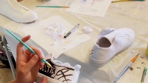 I just finished teaching a “Canvas Shoe Painting” class at the library!