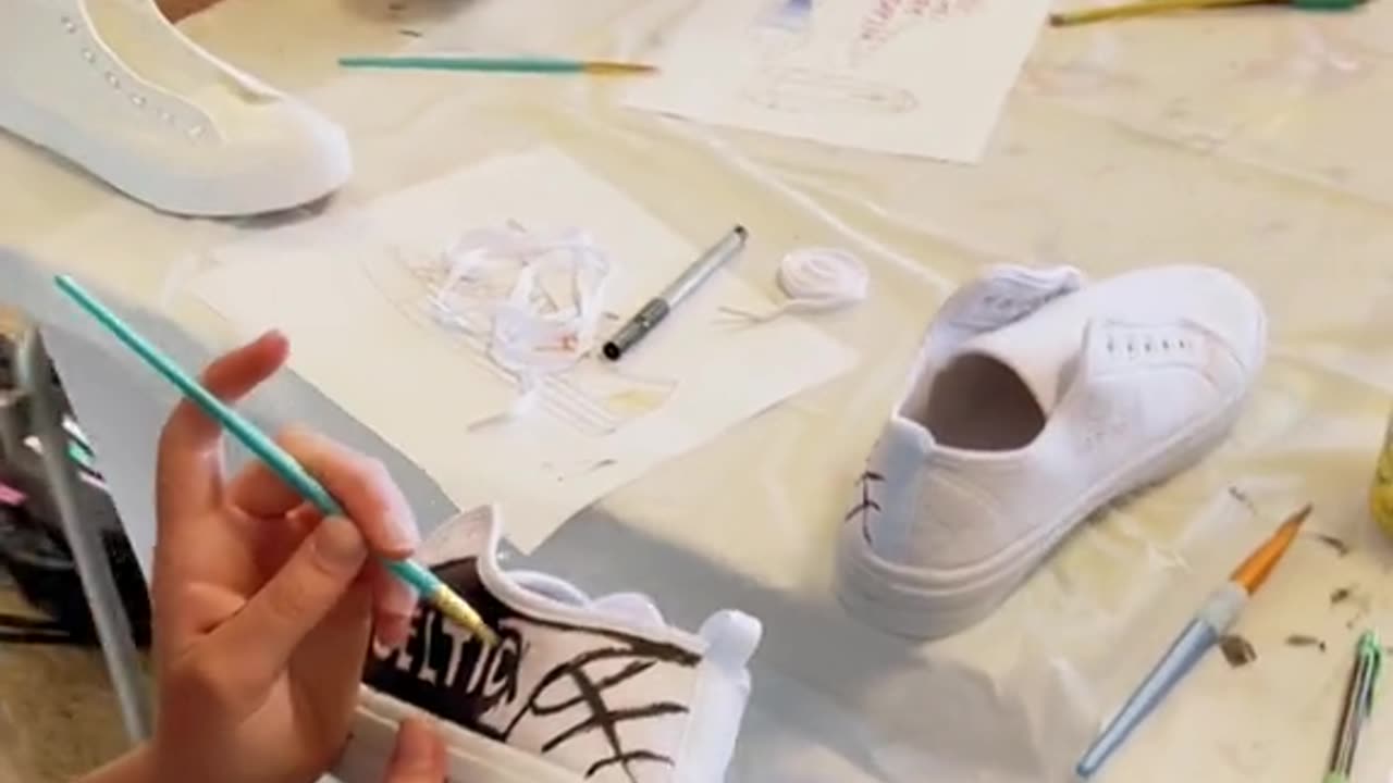 I just finished teaching a “Canvas Shoe Painting” class at the library!