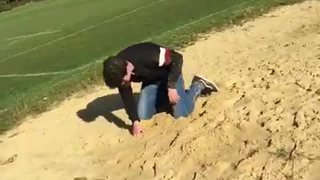 Black sweater sand flip faceplant