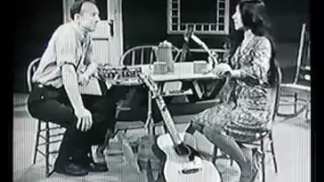 Buffy Sainte-Marie demonstrates the mouthbow to Pete Seeger