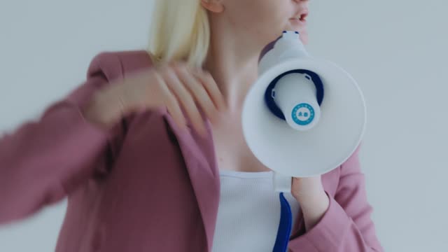 A Woman Screaming on a Megaphone