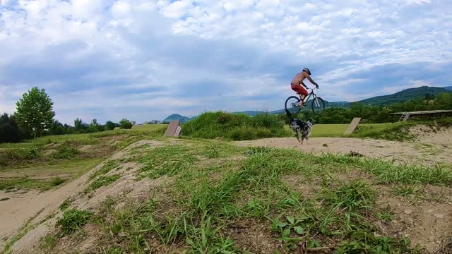 Traildog Morty and his owner flying through the air