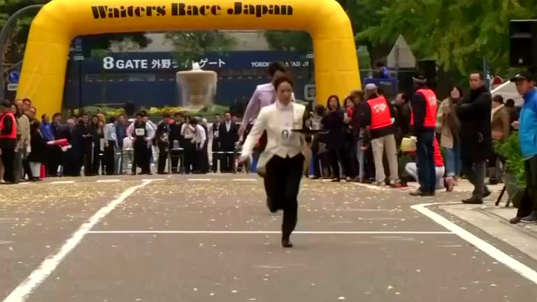 Japanese waiters test their speed