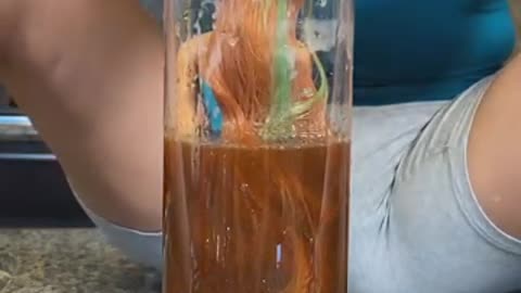 When she PULLS IT OUT OF THE WATER