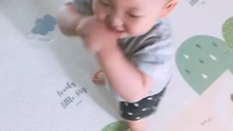 a baby excited by a toy song