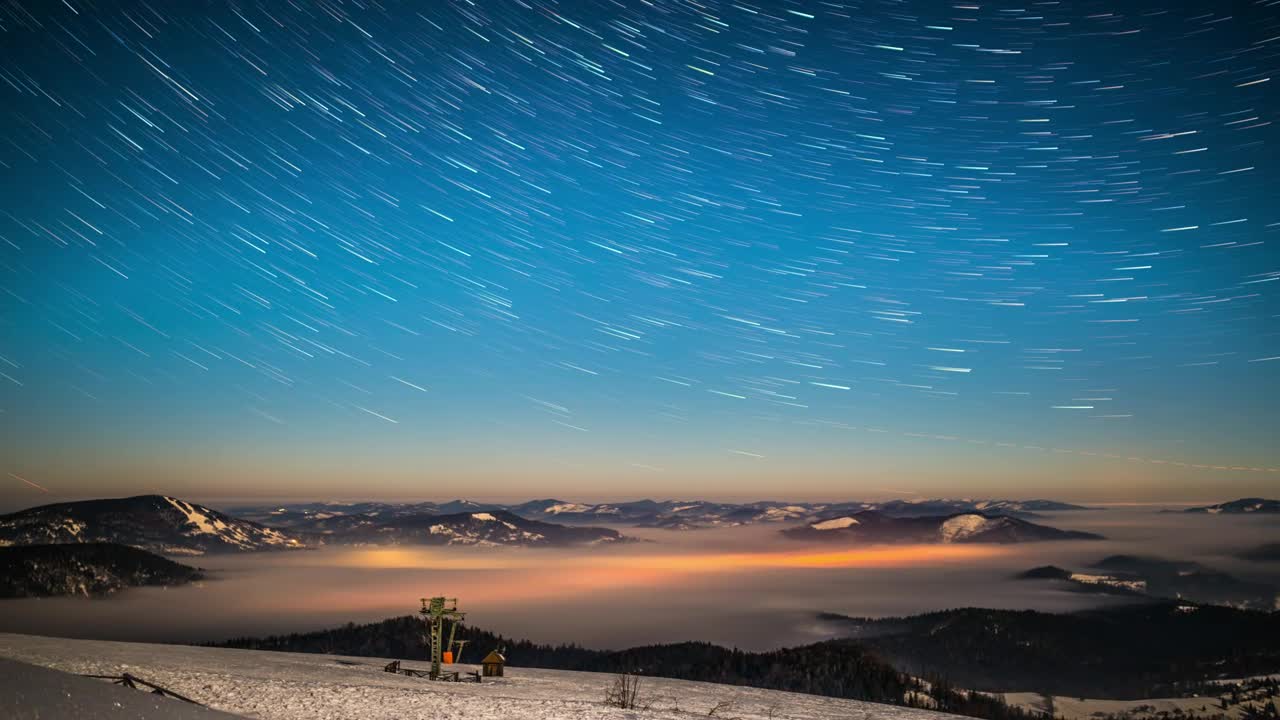 Milky Way moving in the sky at winter landscape